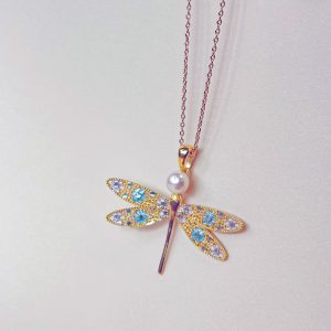 Gold Vermeil Blue Dragonfly Pearl Pendant showcasing light blue enamel wings and a shimmering button-shaped freshwater pearl on a gold chain.